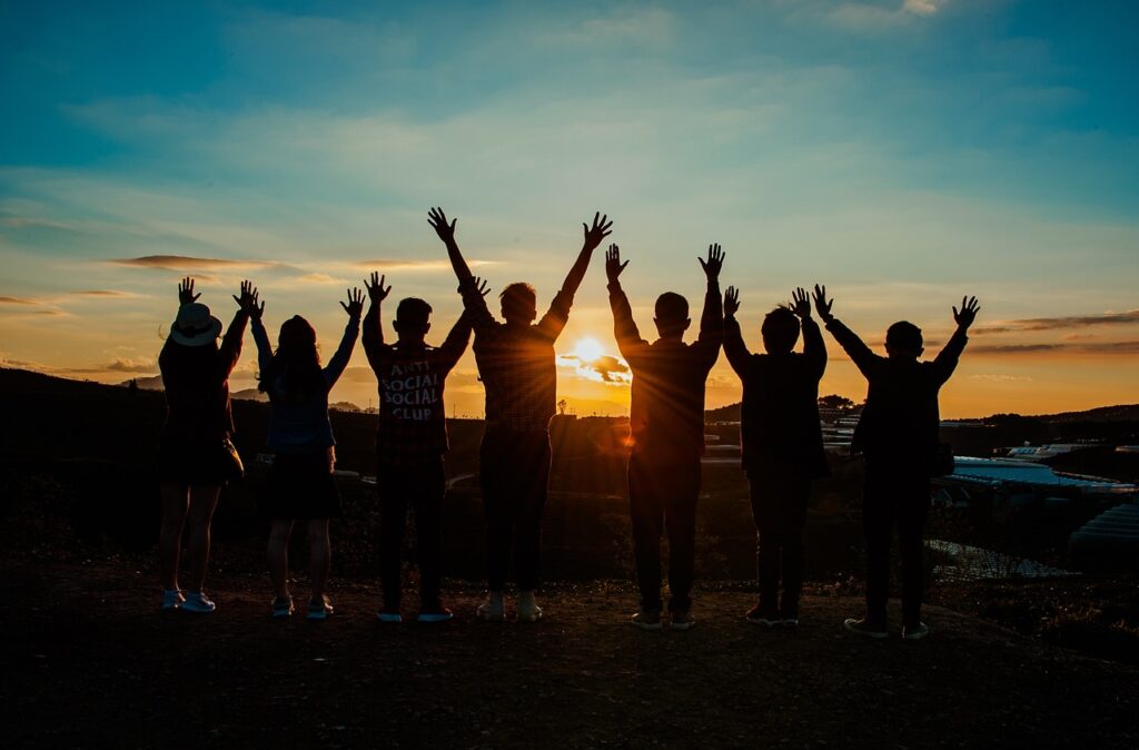 silhouette of young people in the sunset